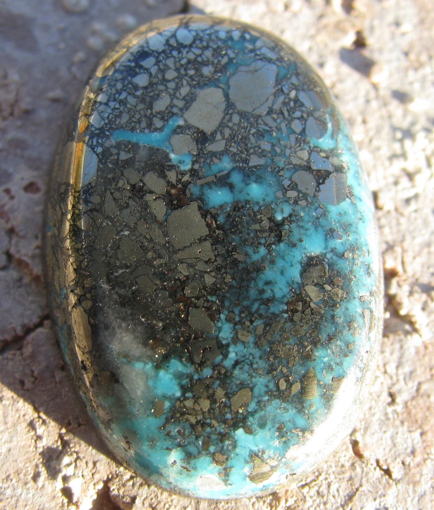 Morenci Turquoise Cabochon with typical pyrite